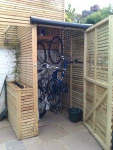 Taller, narrower shed to store bikes upright - takes up less room .