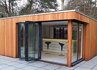 Garden lodge converted into a poolside bar, by Garden Lodges (www .