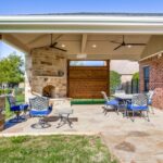 Sunnyvale, TX, hip roof covered stain and stamp patio with outdoor .
