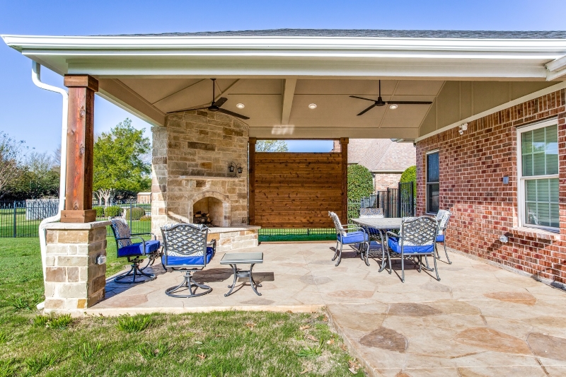 Sunnyvale, TX, hip roof covered stain and stamp patio with outdoor .