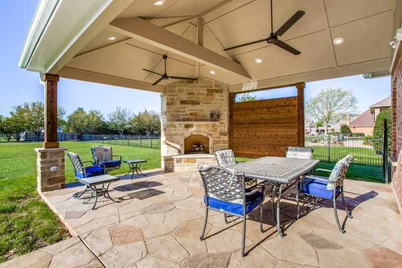 Sunnyvale, TX, hip roof covered stain and stamp patio with outdoor .