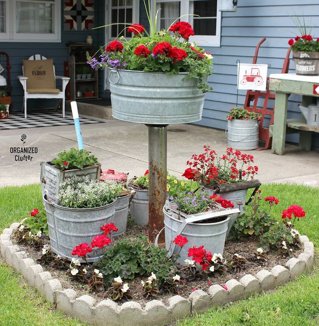 A Gathering of Mop Buckets in a Small Junk Garden | Easy garden .