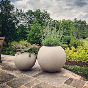 WEll cover | Outdoor planters, Garden planters, Landscaping with roc