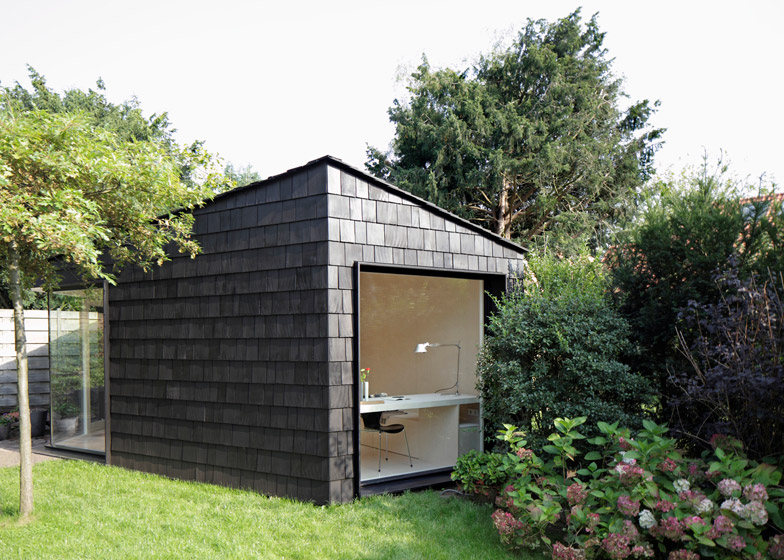 Garden studio has a dark, rough exterior and a light-filled interi