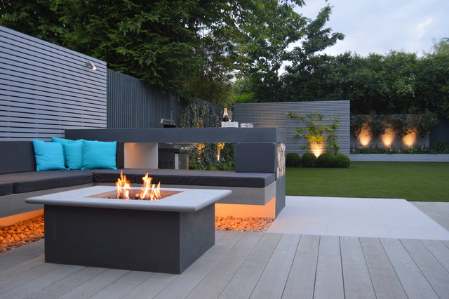 Large modern family garden for entertaining and play .