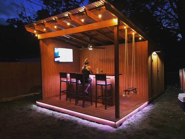 I needed a shed and wanted an outdoor bar so I combined the two .