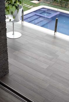 Wood look tiles around pool maybe | Outdoor flooring, Modern pools .